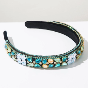 Detail of baroque headband featuring turquoise crystals and white floral accents
