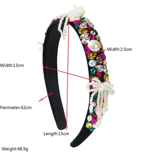 Baroque padded headband detailed with colorful rhinestones, pearls and a bow dimension guide