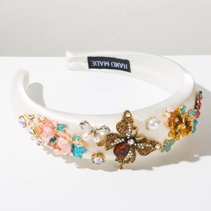 Detailed view of handmade baroque headband with pearls, crystals and gold butterflies