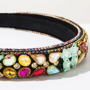Macro detail of Baroque headband with colorful rhinestones and butterfly crystal accents