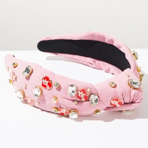 Detail of pink knotted headband with LOVE heart charms and rhinestone embellishments