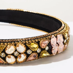 Detailed macro view of luxury baroque headband with sparkling colorful rhinestones