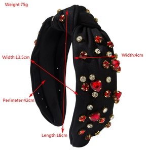 Fashionable knot headband for women featuring red heart rhinestones on black fabric