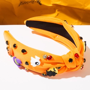 Detail of Halloween knotted headband with sparkling rhinestones and themed patches