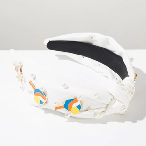 Detail view of knotted white headband with pearls and colorful enamel pickleball charms