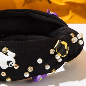 Detail of Halloween knotted headband with ghosts, bats, pearls and sparkling rhinestones