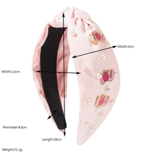 Pink satin wide headband with pearls and dotted letter charms, size details shown