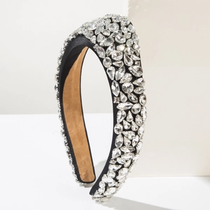 Macro detail of luxury wide headband featuring multi-shaped crystal rhinestones on black satin