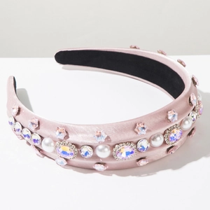 Detail of pink satin headband featuring colorful crystals, floral rhinestones and pearls
