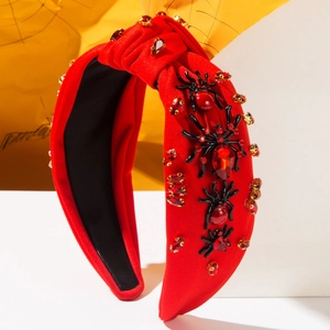 Red knotted Halloween headband with sparkling rhinestones and black spider accents