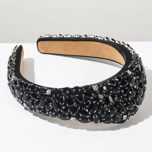 Close-up of luxury Baroque headband with black rhinestones and velvet texture