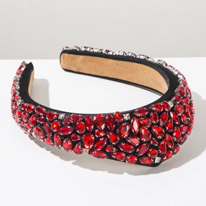 Close-up of luxury Baroque headband with red water-drop crystals and silver rhinestones
