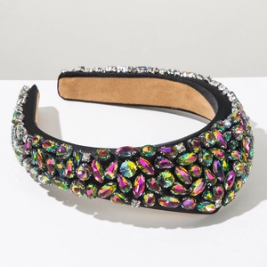 Close-up of luxury Baroque headband featuring multi-color crystals on black fabric