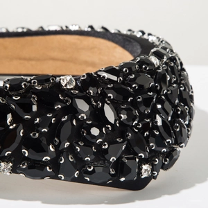 Close-up of luxury Baroque headband with multi-cut black crystals and rhinestones