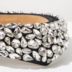 Macro shot of luxury Baroque headband with hand-set geometric crystals on black satin