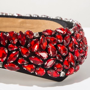 Macro shot of luxury red baroque headband with intricate crystal and rhinestone detailing