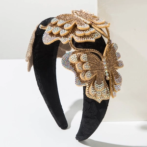 Detail of luxurious black headband featuring crystal-encrusted butterflies on fabric