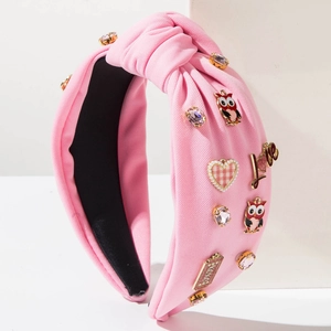 Pink knotted wide headband with owl, heart, and crystal charms for Valentine's Day