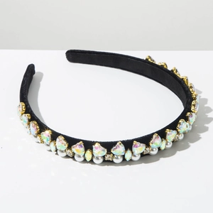 Detailed shot of black velvet headband with sparkling crystals and elegant white pearls