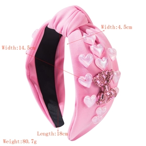 Pink heart knot headband with crystal bow detailing and specific size measurements