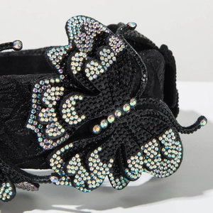 Macro shot of luxury padded headband with black rhinestones and crystal butterfly detail