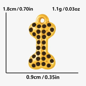 Detailed size view of a gold bone pendant with black rhinestones for DIY jewelry