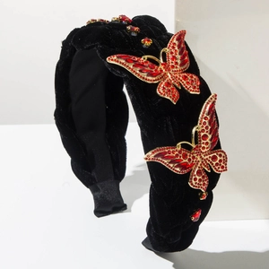 Serre-tête baroque en velours noir orné de papillons étincelants en strass rouges