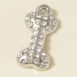 Detailed view of silver bone-shaped charm with sparkling rhinestones for DIY jewelry