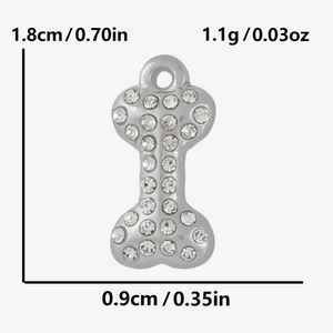 Detailed view of bone-shaped stainless steel pendant with rhinestones and dimensions