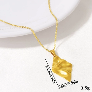 Detail of 18k gold plated 304 stainless steel rhombus pendant with hammered texture and size marks
