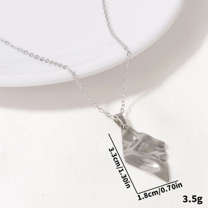 Detailed view of silver rhombic face pendant with dimensions 3.3cm by 1.8cm and 3.5g weight