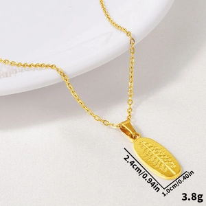 Macro view of 18k gold leaf-vein engraved pendant with dimensions 2.4cm x 1.0cm