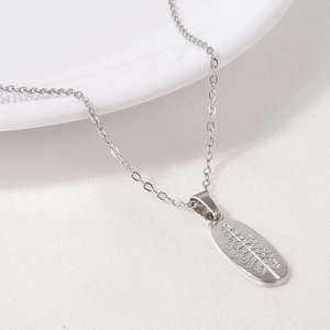 Macro shot of 304 stainless steel necklace with engraved leaf texture on pendant