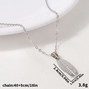 Macro detail of leaf textured stainless steel pendant with size and weight dimensions