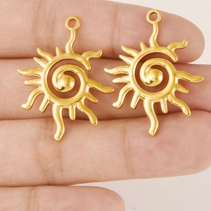 Polished golden stainless steel sun pendant with spiral center and radiant sunburst design