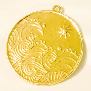 Detailed macro view of 304 stainless steel gold pendant with relief sun and ocean wave pattern