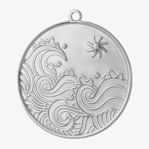 Macro detail of a 304 stainless steel round pendant with embossed wave and sun design