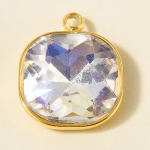 Macro shot of a minimalist square glass crystal pendant in 18k gold plated frame