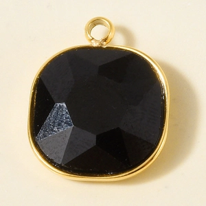 Close-up of cushion-cut black glass pendant with 18k gold plated stainless steel frame