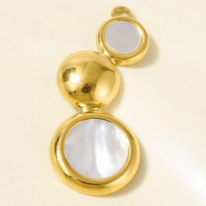 Macro shot of stainless steel pendant with round natural abalone shell and gold finish