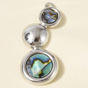 Macro detail of stainless steel necklace pendant with natural abalone shell inlay