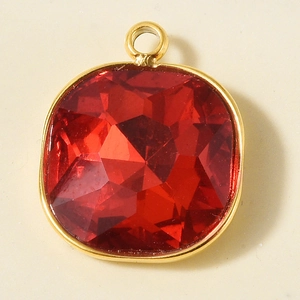 Detail shot of 18k gold plated stainless steel square pendant with red crystal stone