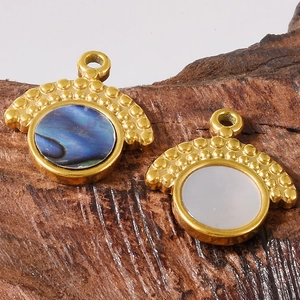 304 stainless steel shell pendants with abalone and white shells on wooden texture