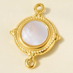 Detailed macro view of gold-plated stainless steel pendant with white mother-of-pearl inlay