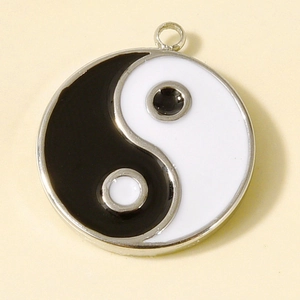 Detailed view of Yin Yang Tai Chi pendant in 304 stainless steel with black white enamel