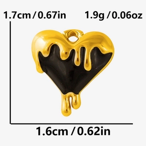 Macro detail of heart charm with gold lava effect on black base, size 1.6cm x 1.7cm