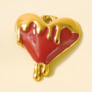 Macro shot of 304 stainless steel red enamel heart pendant with gold melting effect finish