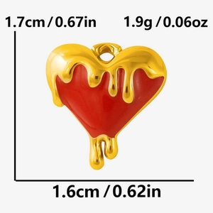 Detailed macro view of heart pendant with red enamel and gold drip effect for DIY jewelry