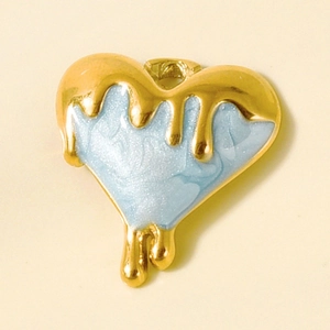 Detailed macro view of heart-shaped 304 stainless steel pendant with blue enamel