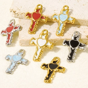 Detailed macro view of 304 stainless steel cross heart pendants with colorful oil drips